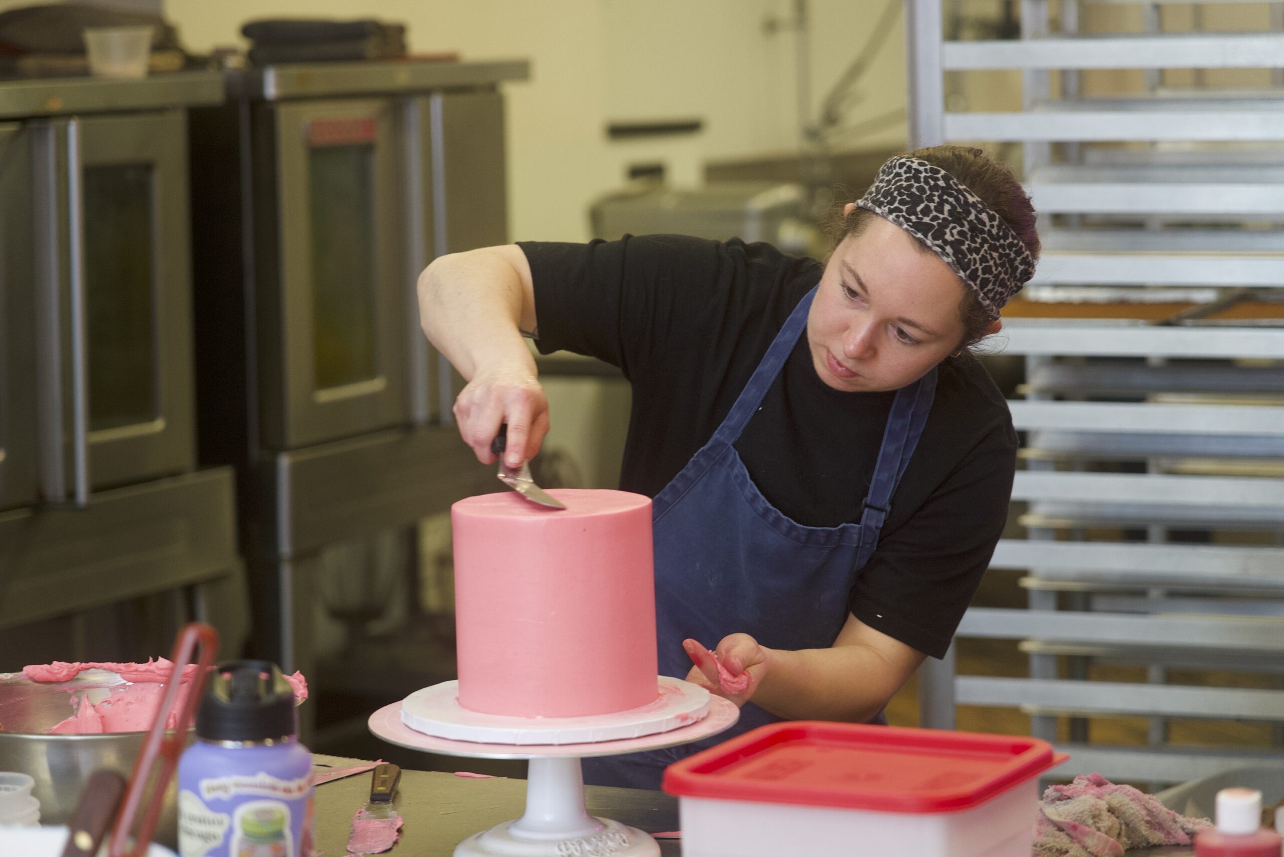 Staff making a cake