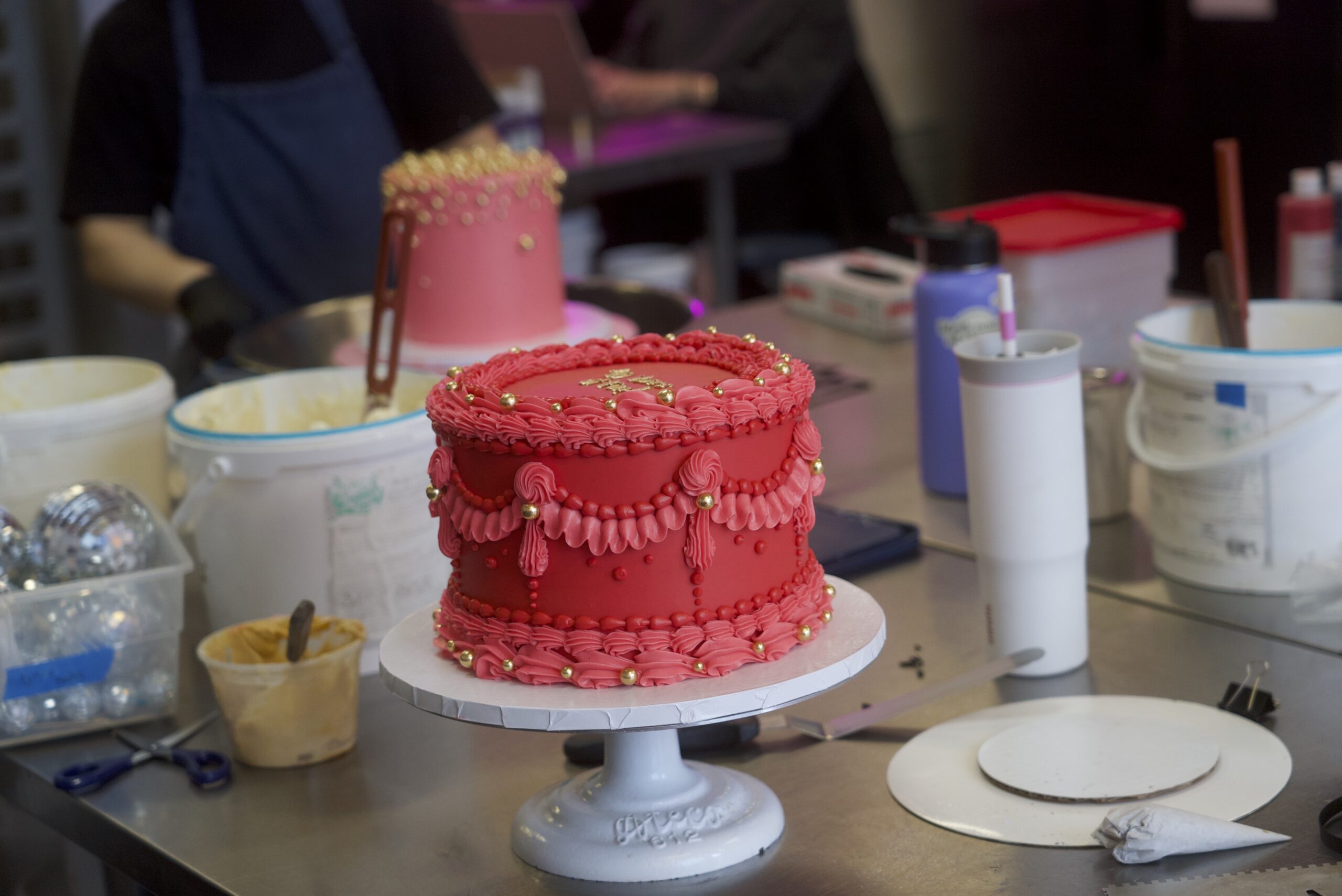 Pink icing cake in the studio